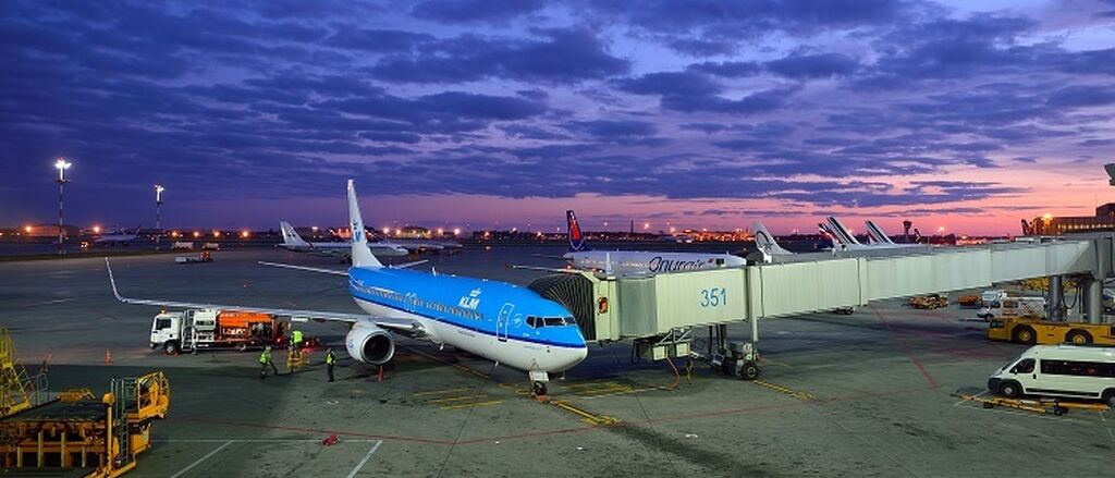 KLM plane connected to passenger tunnel